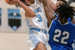 Nature Coast’s ,3, Luke Sanders goes up and over the Sebring defense for a shot Thursday in the Final Game of the Nature Coast Christmas Tournament. Photo by JOE DiCRISTOFALO