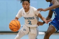 Nature Coast’s ,2,Sheldon Cotton hustles the ball up court against Sebring High Thursday in the Final Game of the Nature Coast Christmas Tournament. Photo by JOE DiCRISTOFALO