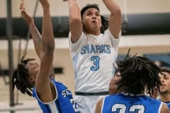 Nature Coast’s ,3, Luke Sanders goes up and over the Sebring defense for a shot Thursday in the Final Game of the Nature Coast Christmas Tournament. Photo by JOE DiCRISTOFALO