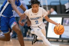 Nature Coast’s ,2,Sheldon Cotton hustles the ball up court against Sebring High Thursday in the Final Game of the Nature Coast Christmas Tournament. Photo by JOE DiCRISTOFALO