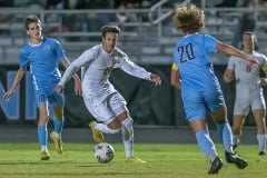 Springstead High’s, 20, Christian Gies tries to work through the NCT defenders, 10, Frank D’Ambrosio and 20, Ryan DiFrank Friday in Brooksville. Photo by JOE DiCRISTOFALO