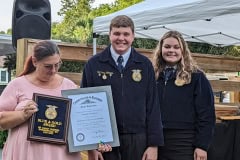 Nancy Moores receives the Blue and Gold Award and was presented with the honorary Kentucky Colonel degree.