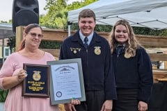 Nancy Moores receives the Blue and Gold Award and was presented with the honorary Kentucky Colonel degree.