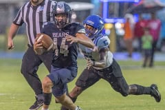 Central High, 14, Braden Joyner attempts to escape the pursuit of Anclote High’s ,5, Damien Spencer. Photo by JOE DiCRISTOFALO