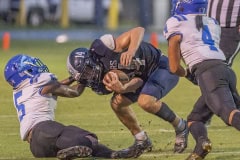 Central High, 14, Braden Joyner is pulled down by a “horse collar tackle” by Anclote High’s ,5, Damien Spencer. Photo by JOE DiCRISTOFALO