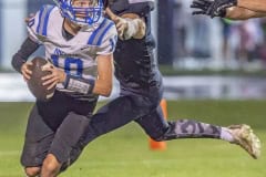 Central High, 7, Caden Bergantino puts the pressure on Anclote QB ,10, Paul Fousek. Photo by JOE DiCRISTOFALO