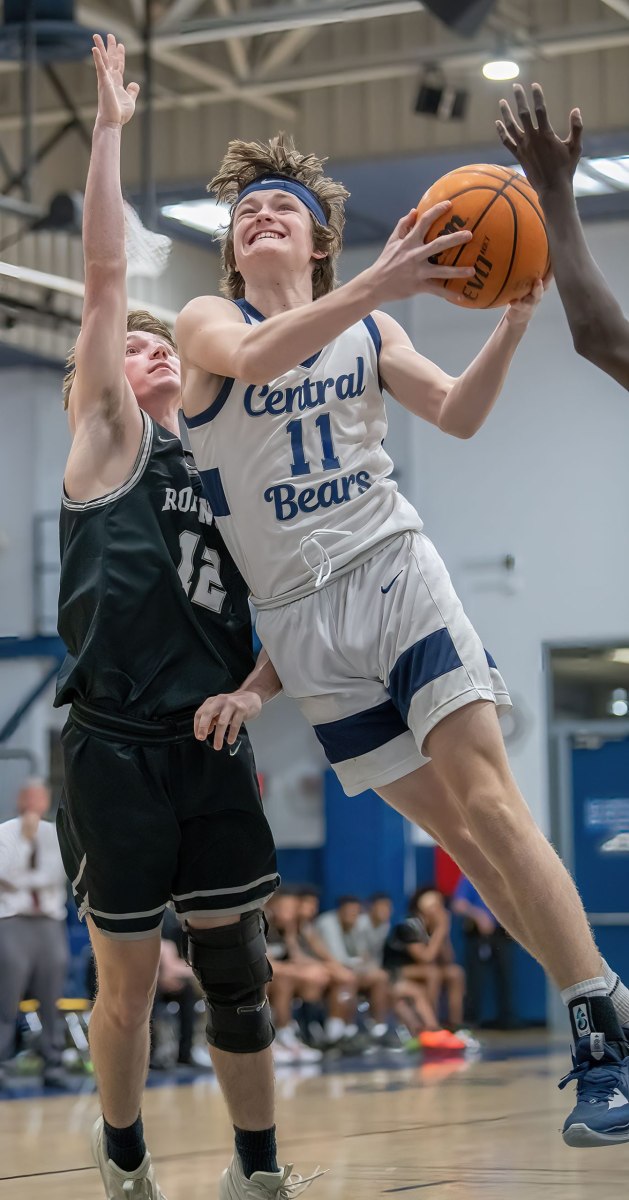 Central High, 11, Ethan Bergantino drives to the basket Thursday in the home 68-33 Regional Quarterfinal win over visiting Robinson High. Photo by JOE DiCRISTOFALO