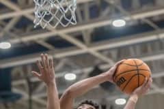 Central High, 21, David Villarroel drives to the basket for the first two points in the 68-33 Regional Quarterfinal win over visiting Robinson High. Photo by JOE DiCRISTOFALO