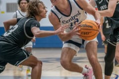 Central High, 12, Caden Bergantino tries to avoid Robinson High defenders on his way to the basket Thursday in the home 68-33 Regional Quarterfinal victory. Photo by JOE DiCRISTOFALO