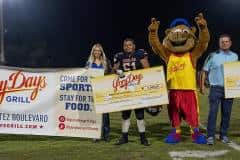 Half time presentation from Glory Days Grill,$1000 scholarships to Springstead High’s Giovanni Chorinos and Hernando High’s John Capel III. Representing Glory Days from left to right, Autumn  Soldo,Aarolyn Evans, JD Marchido - mascot, Rory Marchido -  Glory Days owner. Photo by Joe DiCristofalo.