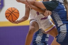 Hernando High, 4, Kayla Holloman works to put up a shot  while defended by Central High, 32, Jezline Rosado Friday 1/6/23 at Hernando High. Photo by JOE DiCRISTOFALO