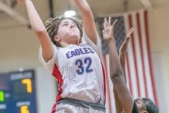 Springstead , 32, Addy Osborne shoots over Gulf High’s ,14, Ania Butler Wednesday in the Springstead Holiday Tournament. Photo by JOE DiCRISTOFALO