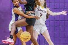 Hernando Leopards Junior #4 Kayla Holloman and Fr. #2 Savanna Condron team work against Weeki Wachee #4 Name unknown in Tuesday 12/13/22 nights game. Photo by Cheryl Clanton.