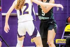 Weeki Wachee Senior #5 Joelysee Morales passes the ball with a pack of Leopards around her. Photo by Cheryl Clanton.