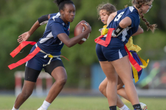 Springstead High’s , JZ Munford, 14, follows the block by ,9, Alisha Soults in the flag football match versus visiting Hernando High. Photo by JOE DiCRISTOFALO
