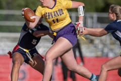 Hernando High, 11, J.R. Steinkamp splits two Springstead defenders for a gain Monday in Spring Hill. Photo by JOE DiCRISTOFALO