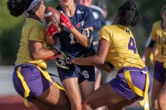 Springstead High’s ,17, Kandace Hanshaw has her progress stopped after catching a pass by Hernando High’s ,7, Shane Rayford and 4, Kayla Holloman Monday at Booster Stadium. Photo by JOE DiCRISTOFALO