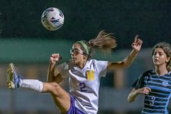 Hernando ,2, Jackie Cuevas uses an over the head backwards kick to clear the ball out of the Hernando end . Photo by JOE DiCRISTOFALO.