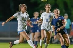 Springstead, 2, Riley Bradley gets off a shot just ahead of the Nature Coast Tech defense by ,14, Giada Chechile and Joise Dahmer Friday in Spring Hill. Photo by JOE DiCRISTOFALO.