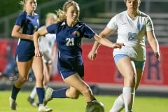 Springstead, 21, Sarah Frazier races into the scoring zone while checked by Nature Coast ,22, Brooke Cheze Friday during Springstead High’s Senior Night. Photo by JOE DiCRISTOFALO.