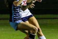 Springstead Junior #32 Sidney Anderson and NCT Shark Junior #3 Jaiden Gilbert battle for the ball in Wednesday nights game 12/14/22. Photo by Cheryl Clanton.