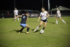 Springstead Riley Bradley dodges Nature Coast's Lorriane Sivon SHS vs NTC 12/14 By Hanna Fox.