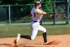 Sharks #3 So.Haley Keane throwing to first base for the out against the Leopards. Photography by Santo.