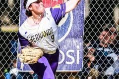 Leopards #9 Sr. Sydney Cline throws ball in from left field. Photography by Santo.