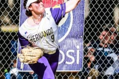 Leopards #9 Sr. Sydney Cline throws ball in from left field. Photography by Santo.