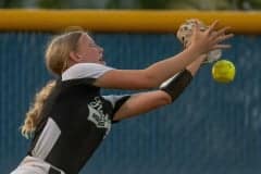 Weeki Wachee High’s left fielder, Abigail Pyle, narrowly misses a line drive off the bat of Springstead High’s Alexis Adelman in the game at Springstead High. Photo by JOE DiCRISTOFALO