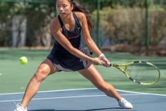 Hernando High’s Mia Liu concentrates on a backhand return in a doubles match versus Central High at Brooksville Park Tuesday afternoon. Photo by JOE DiCRISTOFALO