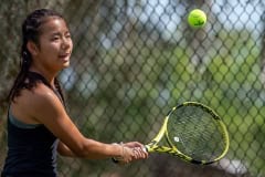 Hernando High’s Mia Liu concentrates on a backhand return in a doubles match versus Central High at Brooksville Park Tuesday afternoon. Photo by JOE DiCRISTOFALO