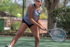 Central High’s Zioneliz Miranda-Perez eyes her target for a backhand return in a doubles match with Hernando High Tuesday in Brooksville. Photo by JOE DiCRISTOFALO