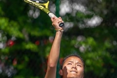 Hernando High’s Mia Liu concentrates during a serve in a doubles match versus Central High at Brooksville Park Tuesday afternoon. Photo by JOE DiCRISTOFALO