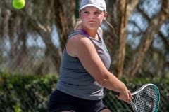 Central High’s Natalie Kupres zeroes in on a backhand in a doubles match with Hernando High Tuesday in Brooksville. Photo by JOE DiCRISTOFALO