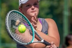 Central High’s Natalie Kupres looks to place a forehand volley in a doubles match with Hernando High Tuesday in Brooksville. Photo by JOE DiCRISTOFALO