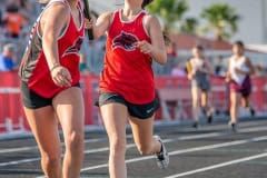 Powell Middle School’s Gabrielle Larocca passes the baton to teammate Talia Bateman in the 4 x 400 relay in the Hernando County Middle Athletic Conference Track Championship.  Photo by JOE DiCRISTOFALO