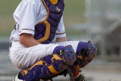 Hernando High catcher, Drew Bittenger, looks into the dugout for a pitch sign during Friday night’s game 4/21/23 with Lecanto High. Photo by JOE DiCRISTOFALO