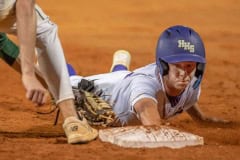 Hernando High’s Drew Vanalstine gets back to first base to avoid being picked off in the game  against visiting Lecanto High Friday, 4/21/23, in Brooksville. Vanalstine later stole second and scored in the inning. Photo by JOE DiCRISTOFALO