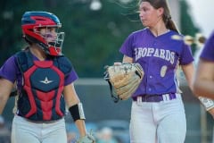 Hernando High catcher, Hannah Taylor and pitcher Ava Braswell converse between innings of their regional playoff game versus Trinity Catholic Wednesday at Tom Varn Park. Photo by JOE DiCRISTOFALO
