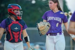 Hernando High catcher, Hannah Taylor and pitcher Ava Braswell converse between innings of their regional playoff game versus Trinity Catholic Wednesday at Tom Varn Park. Photo by JOE DiCRISTOFALO