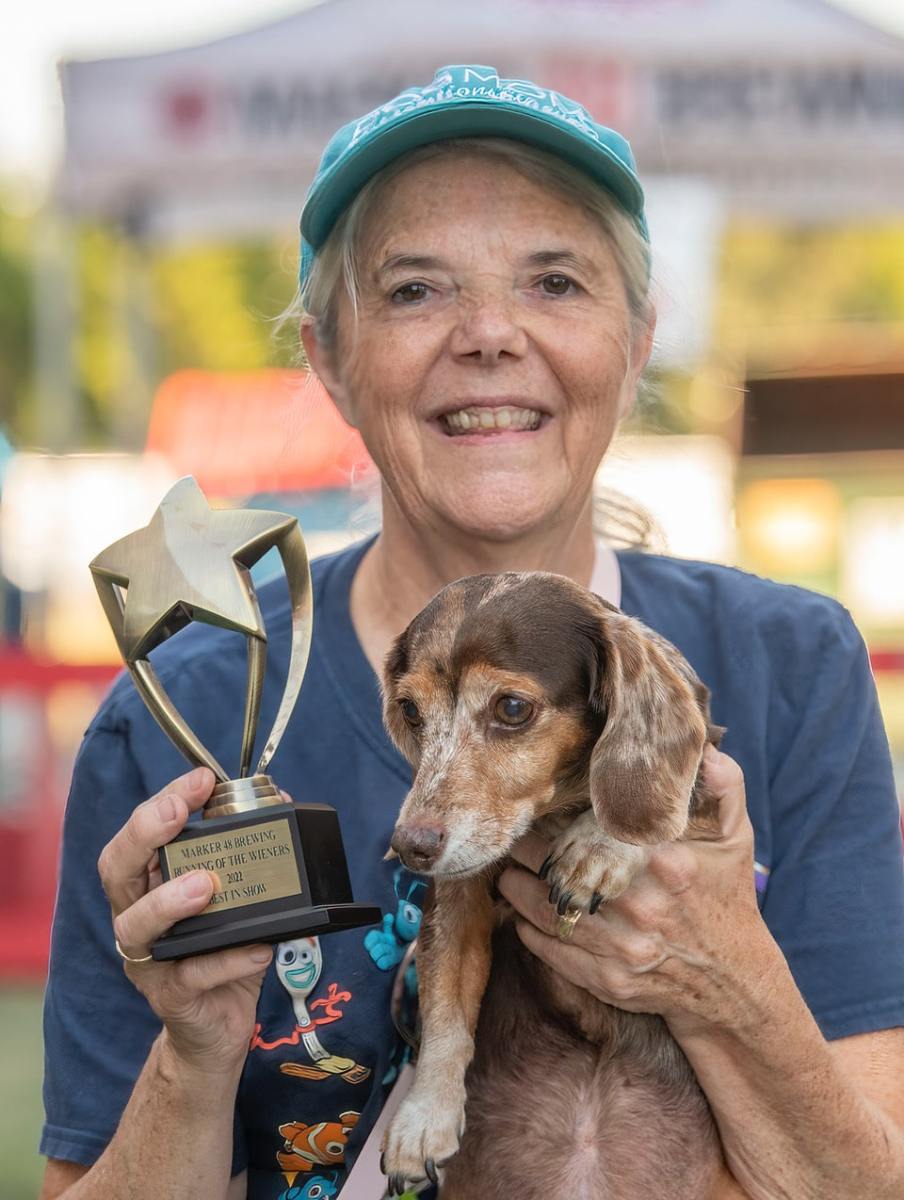 Molly, named Best in Show and her owner Janice VanOss at the Marker 48 “Running of the Wieners. Photo by JOE DiCRISTOFALO.