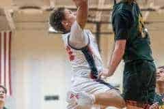 Springstead High's ,12, Austin Nicholson tries to shoot while defended by Lecanto High’s,14, Tristan Loreth . Photo by Joe DiCristofalo