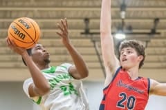 Weeki Wachee, 24, Anthony Wilson eyes the basket as Andrew Danchise, 20, defends for Springstead Friday 12/9 at Weeki Wachee High School. Photo by JOE DiCRISTOFALO.