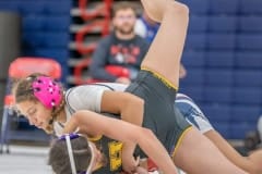 Springstead High, Jasmine Serrano takes down Elissa Rice from Hernando High in the 120 pound weight class. Photo by JOE DiCRISTOFALO