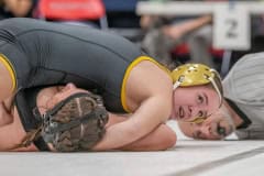 Hernando High 125 pound,  Daniela Espinal,top,  waits for the pin signal in her win over Alycia Rivera from Citrus High. Photo by JOE DiCRISTOFALO