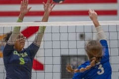Central High, 9, Jade Harper attempts to block the hit by HCA, 3 Mackenzie Graf Tuesday at Central High. Photo by Joe DiCristofalo.
