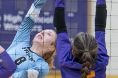 Nature Coast Jr. Addison Carpenter looks to hit past the defense by Hernando High’s Jacqueline Cuevas Tuesday in Brooksville. Photo by Joe DiCristofalo