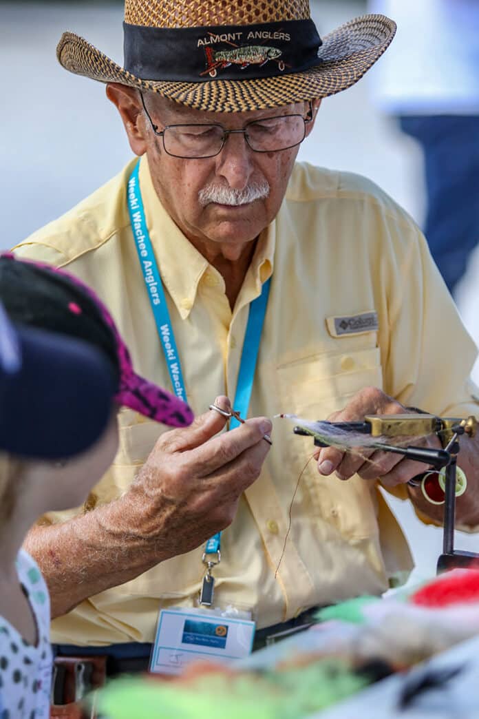 Weeki Wachee Angler member and volunteer Jim Day demonstates how to build fishing lures  during the Kids Fishing Clinic on Saturday at Linda Pederson Park. Photo by Alice Mary Herden