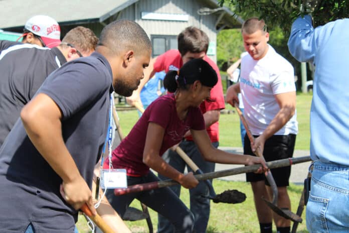 Project Looking Ahead students assist with planting the trees